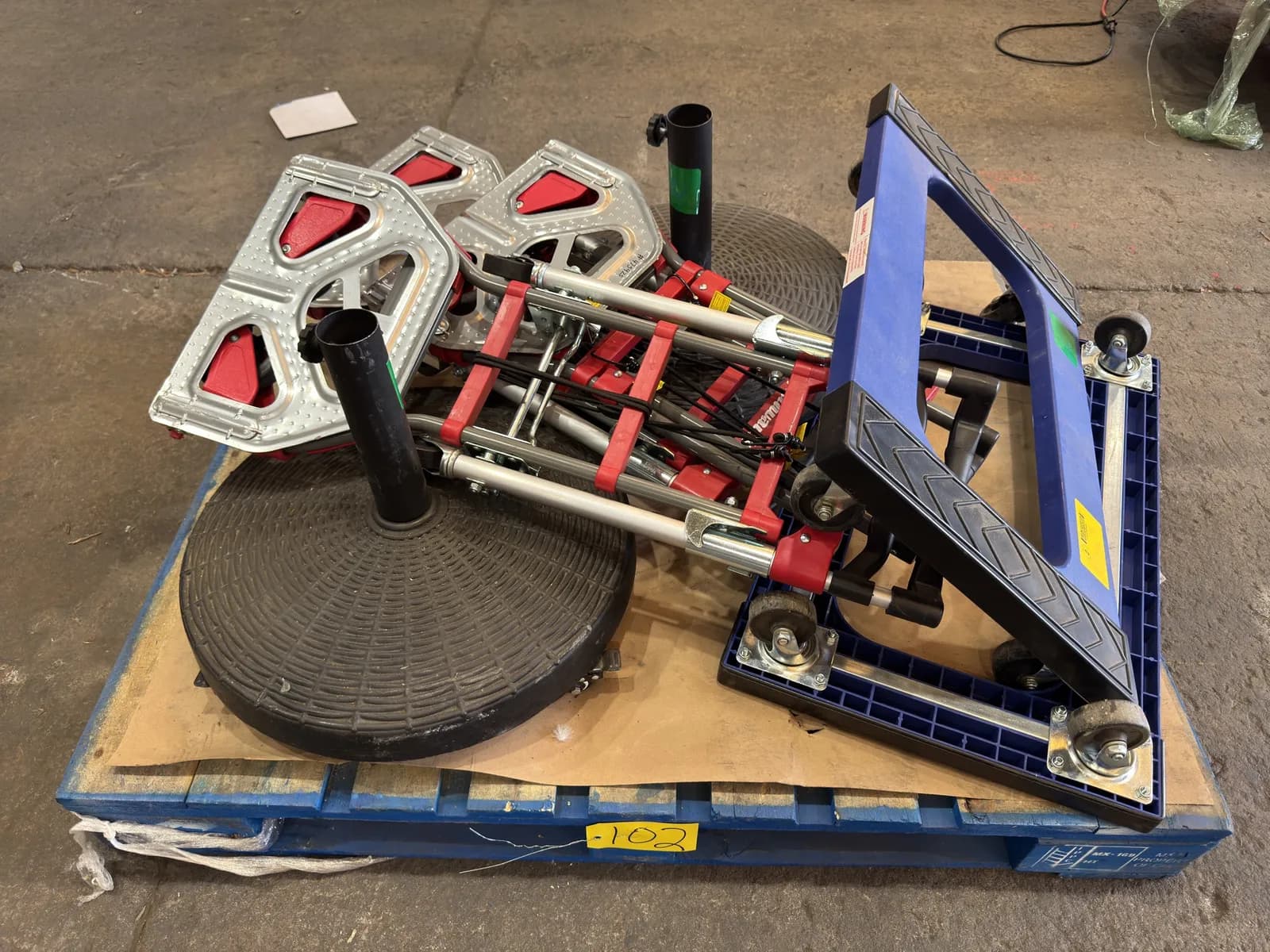 contents-of-pallet-2-umbrella-stands-3-milwaukee-hand-carts-and-2-dollies-mpn9h5ok