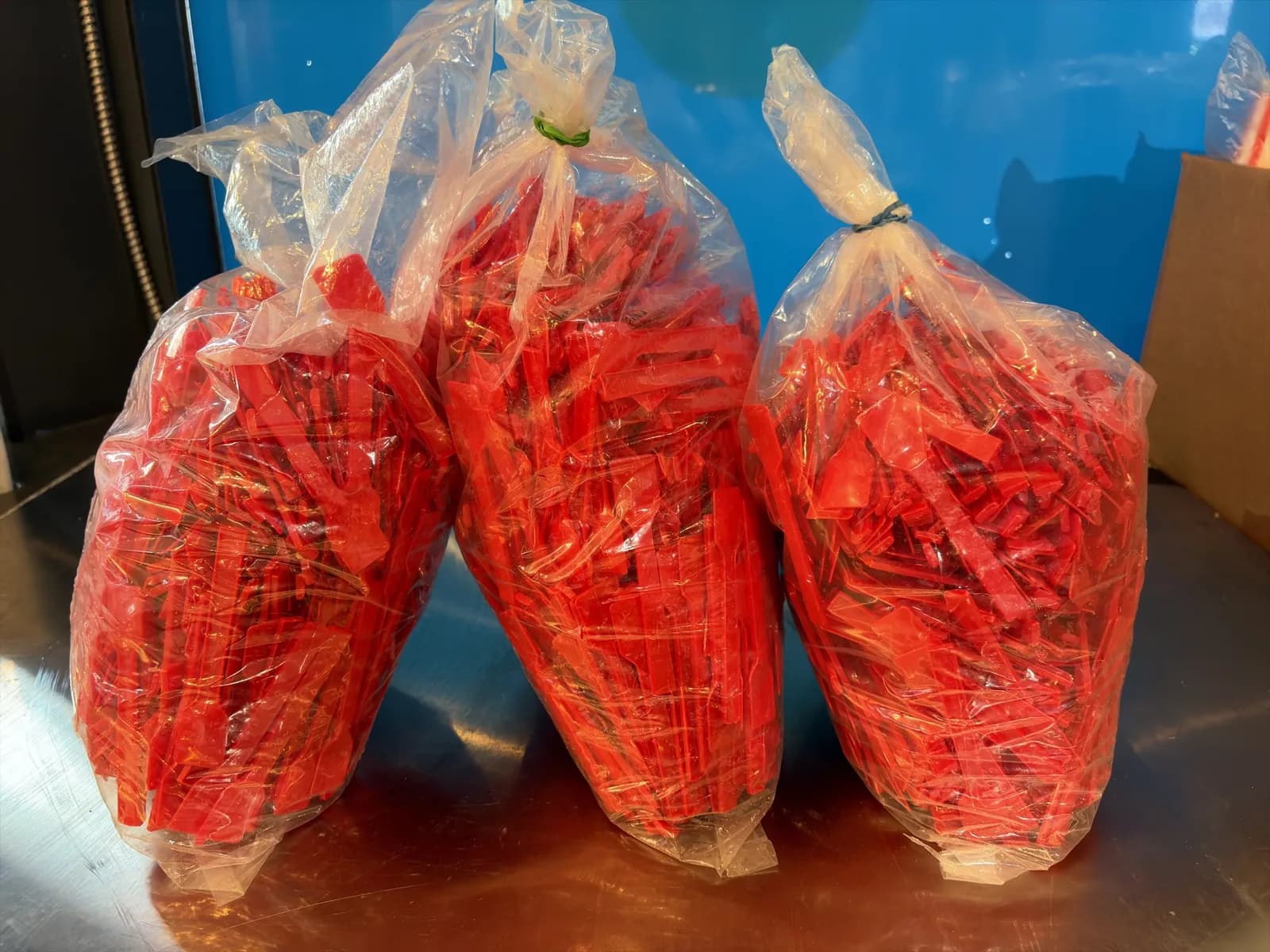 3-bags-of-red-plastic-4-spoons-mpq3u1v0