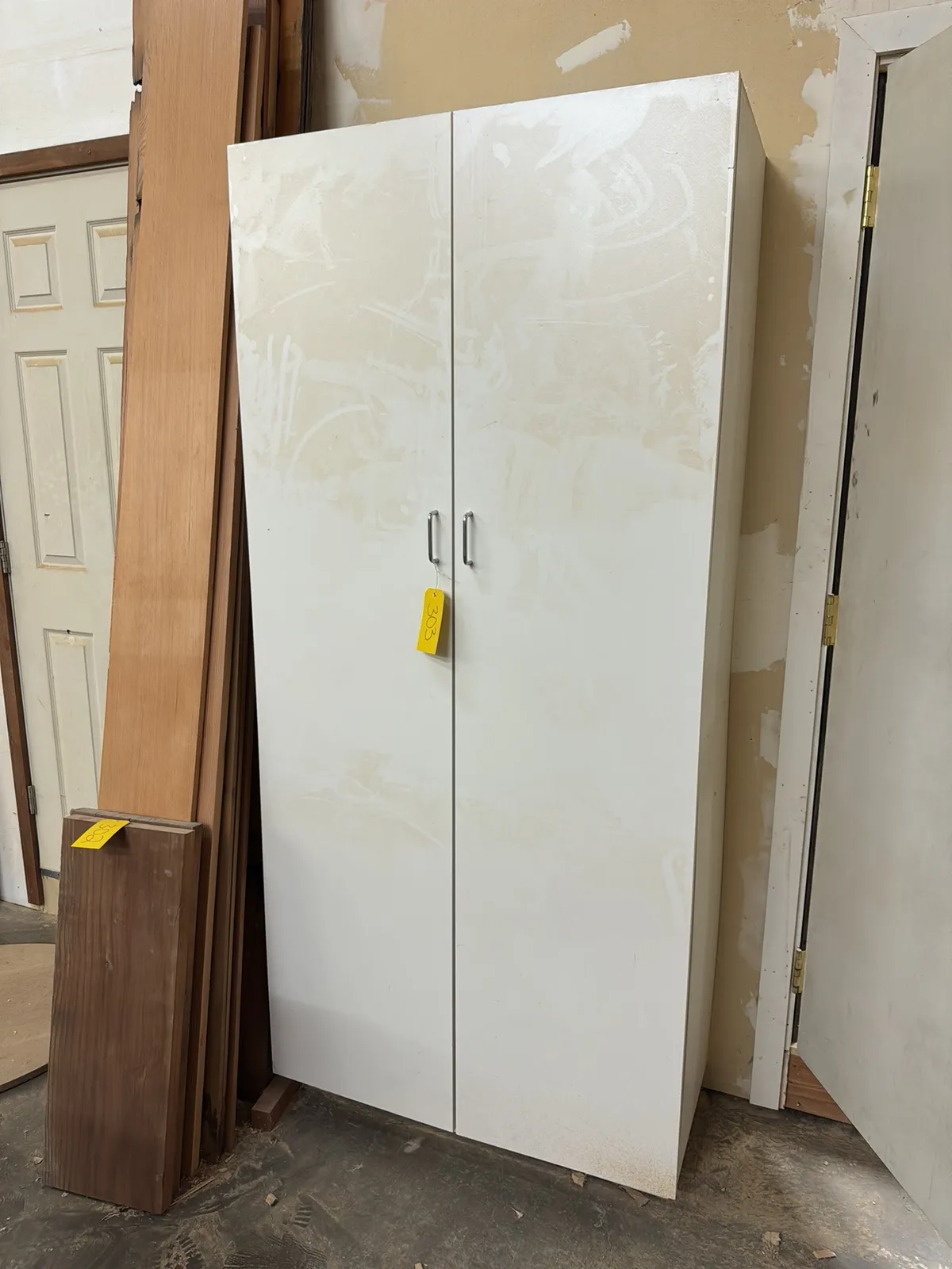 cabinet-and-contents-cabinetry-books-samples-and-machine-parts-mud74zuj