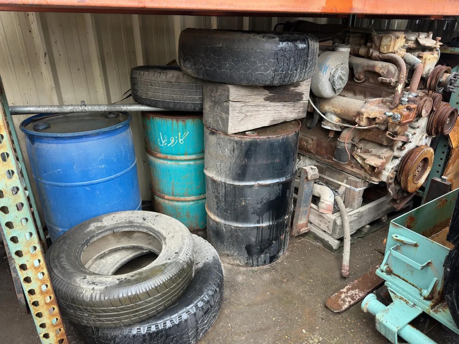 contents-of-section-inline-6-diesel-motor-tires-and-55-gallon-barrels-mvtlp0k2